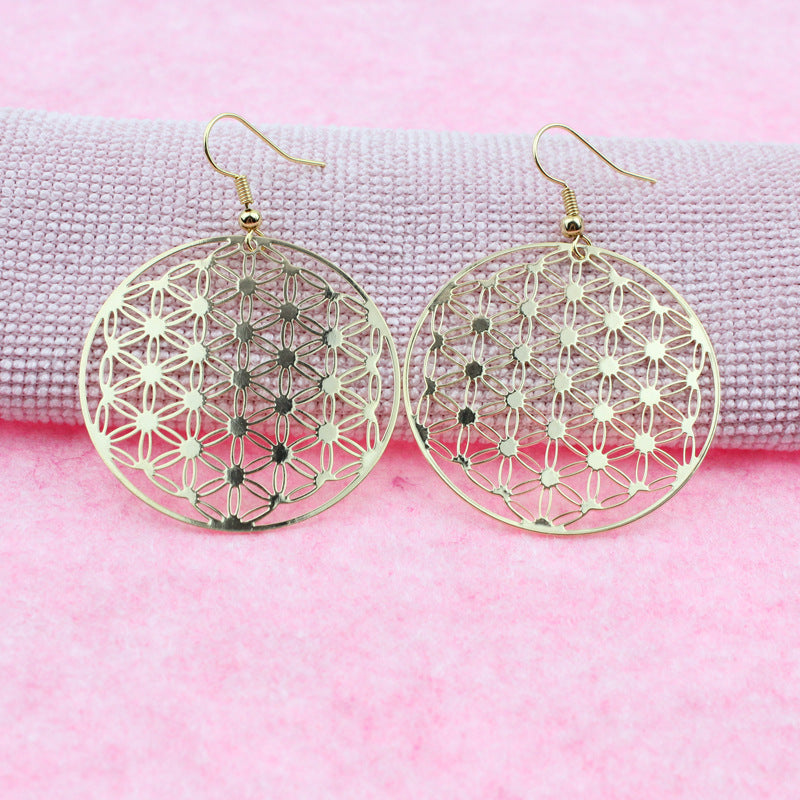 Boucles d’oreilles Fleur de Vie dorées sur fond rose – Caelvero